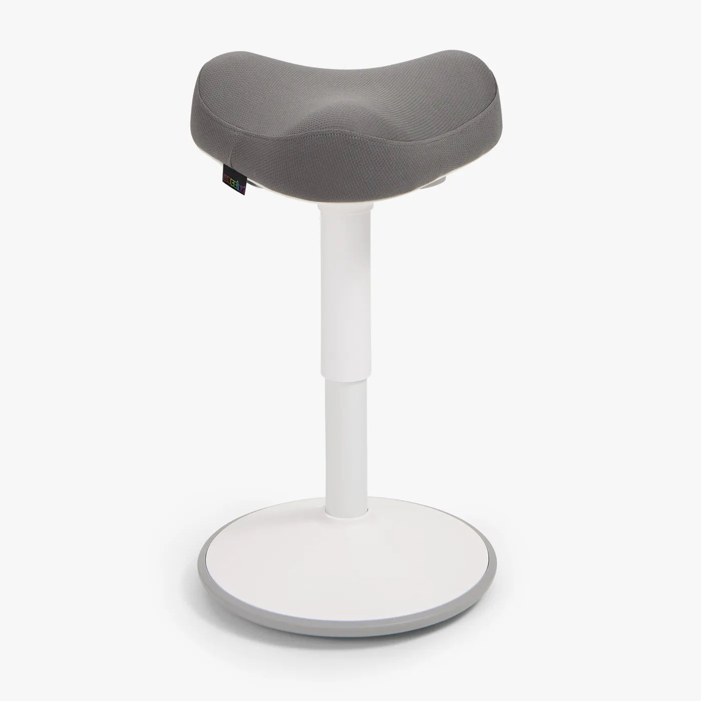 A Wobblez Soothe saddle wobble stool designed for ergonomic support, featuring a curved dark grey seat and a white frame stable base.