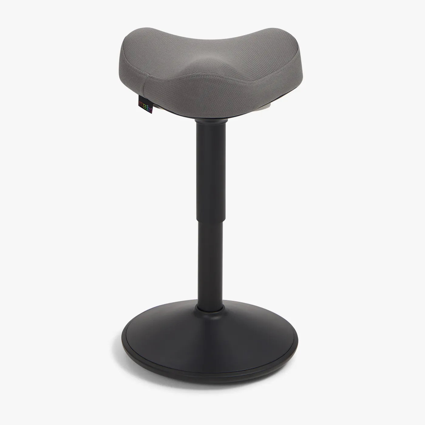 A Wobblez Soothe saddle wobble stool designed for ergonomic support, featuring a curved dark grey seat and a black frame stable base.