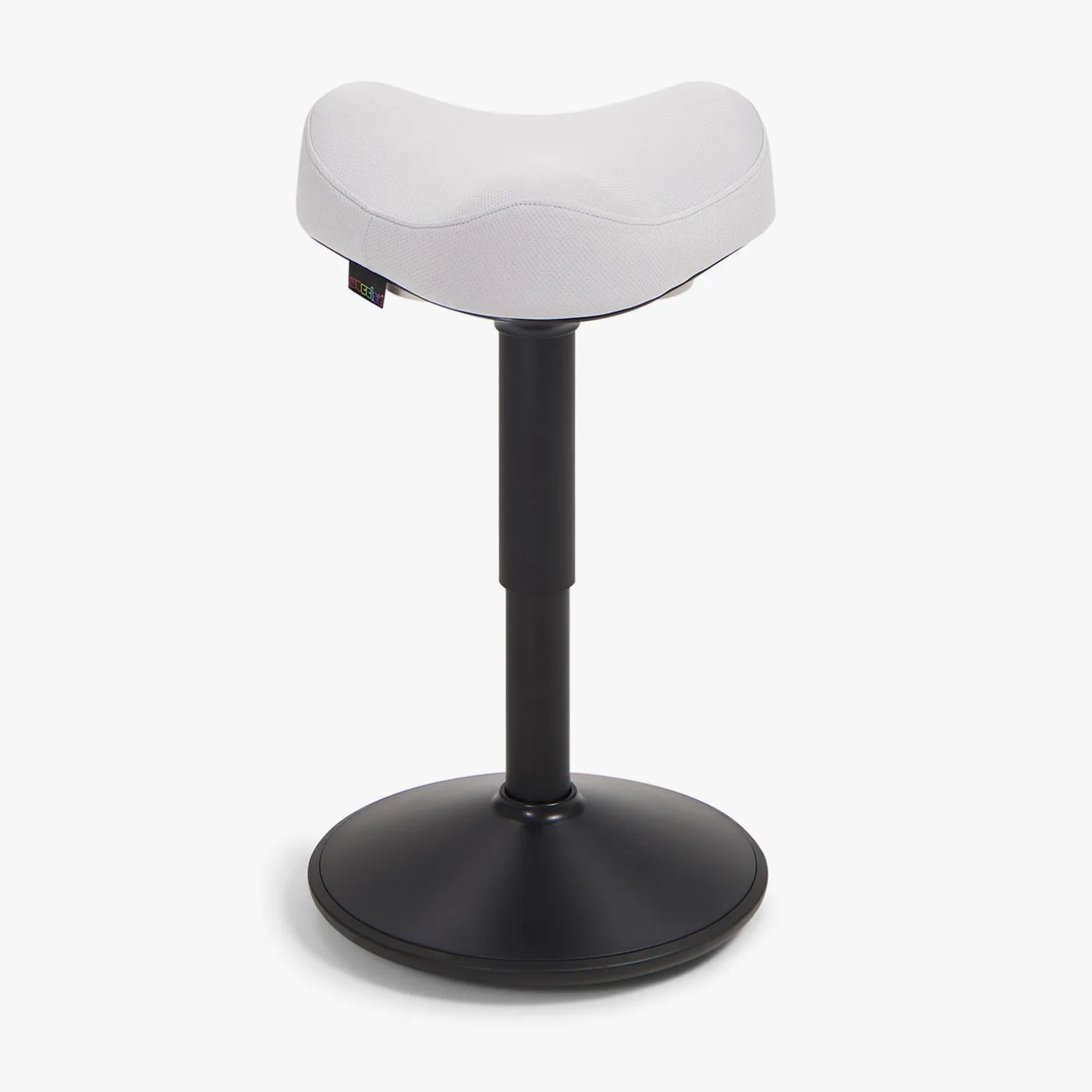 A Wobblez Soothe saddle wobble stool designed for ergonomic support, featuring a curved light gre seat and a black frame stable base.