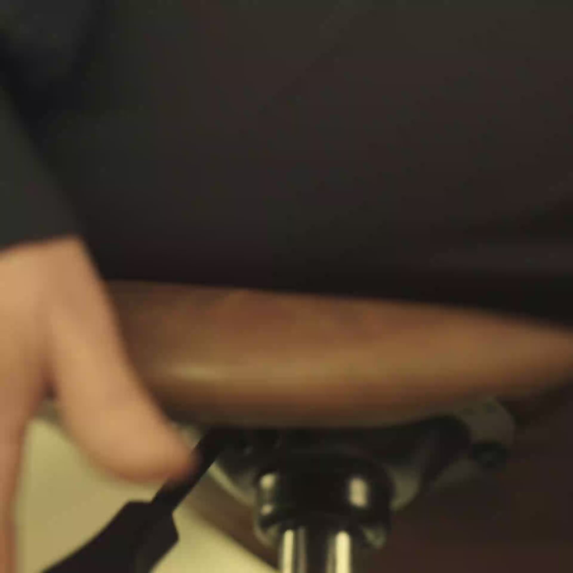 Closeup Short video of 4 seconds of person pulling the lever of a Wobblez Stable stool to showcase adjusting the height