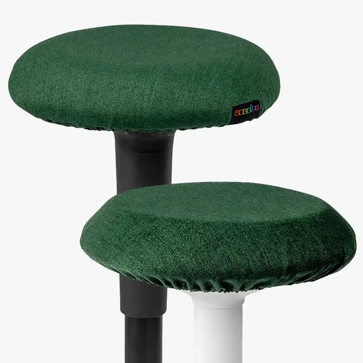 Studio photography of Forest Green Wobblez Skins, premium seat stool covers slip over a Spine and Savvy wobble stools with white neutral background