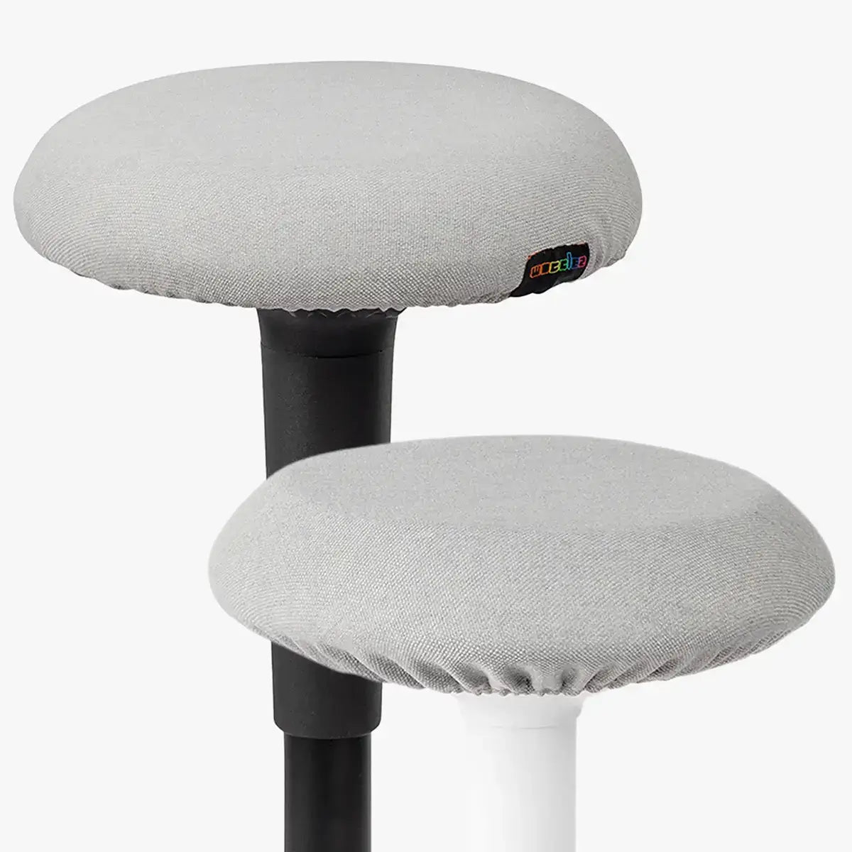 Studio photography of Metallic Grey Wobblez Skins, premium seat stool covers slip over a Spine and Savvy wobble stools